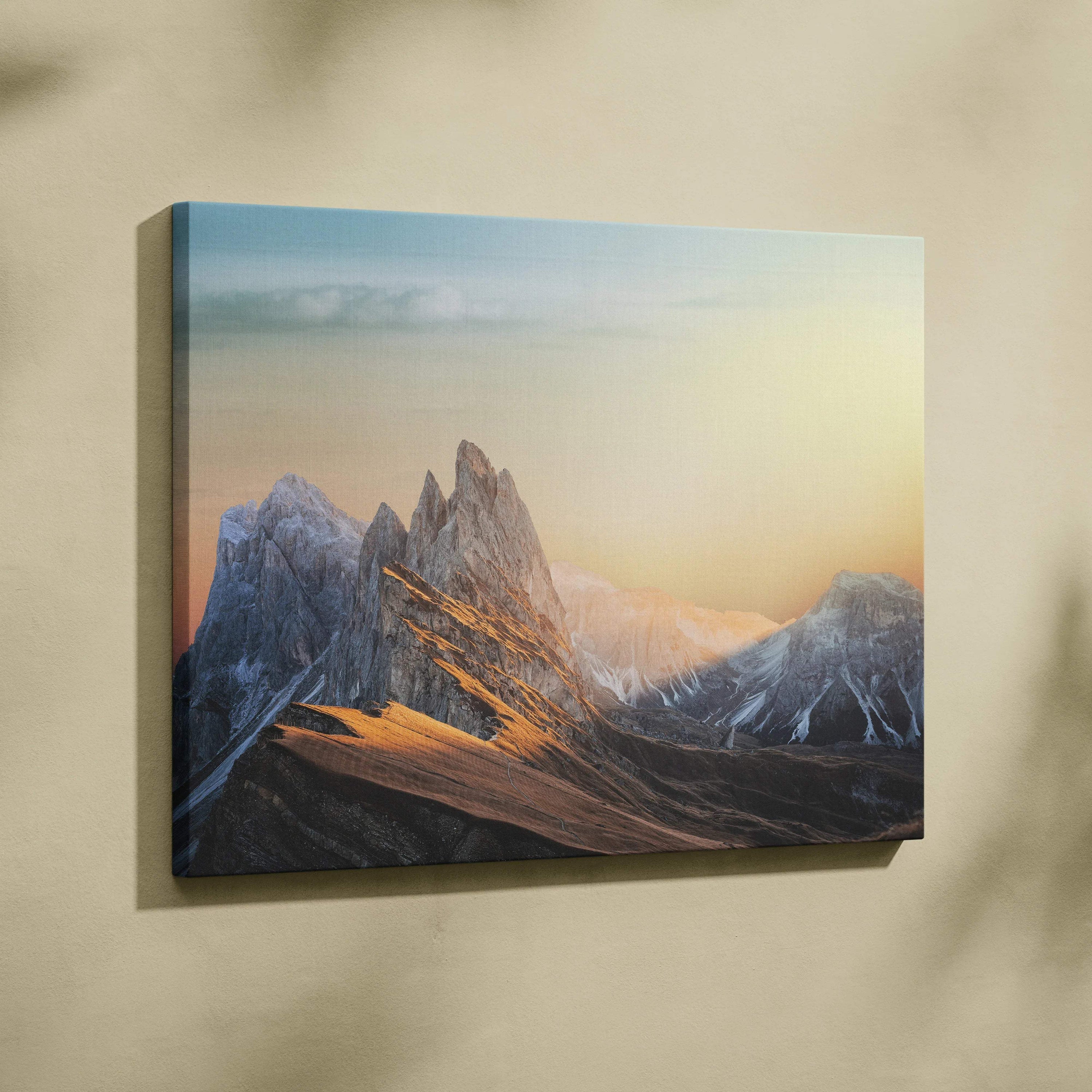 Cinematic mountain sunrise canvas wall art with jagged peaks in warm golds