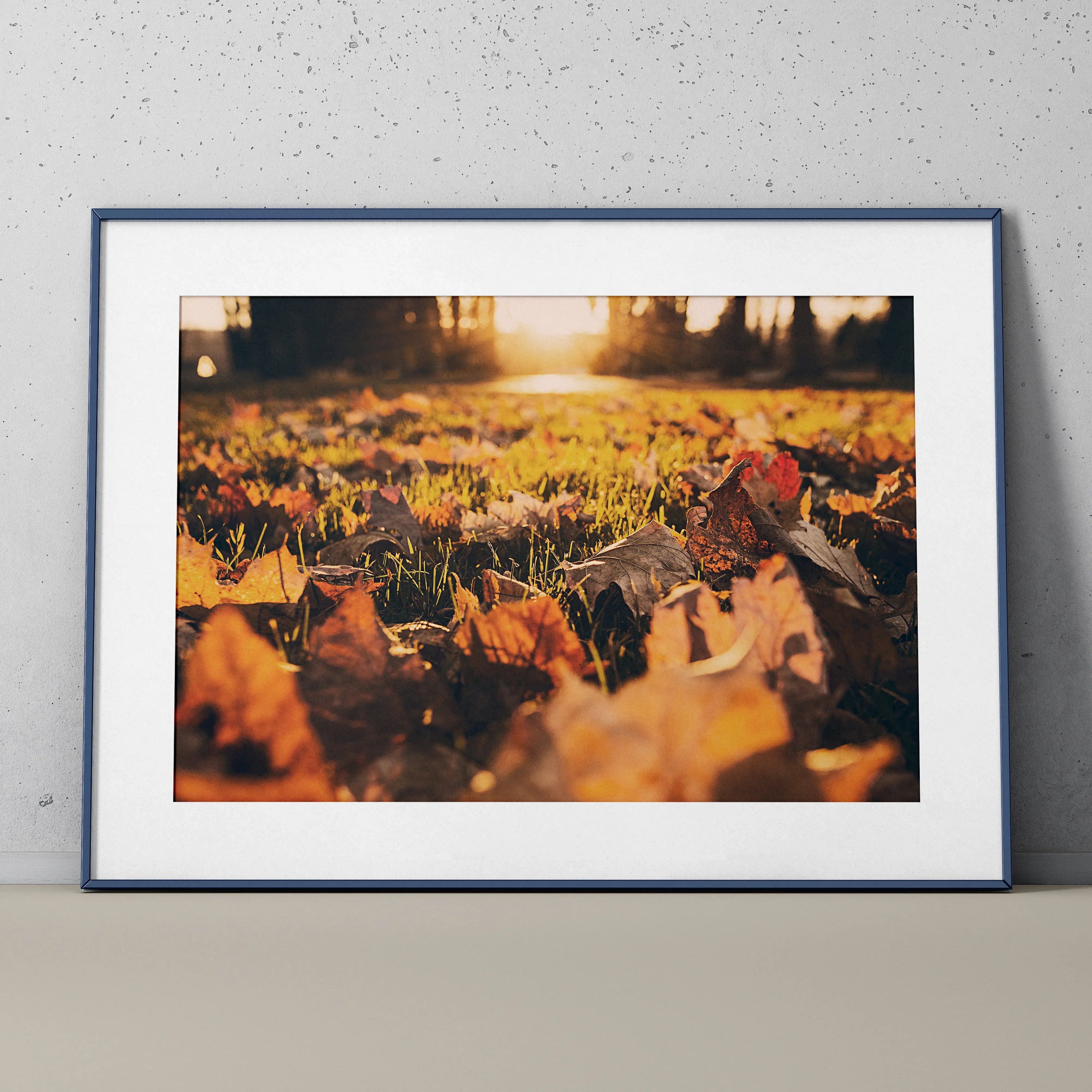 Vibrant autumn leaves close-up poster with warm sunlight nature wall art in white frame.