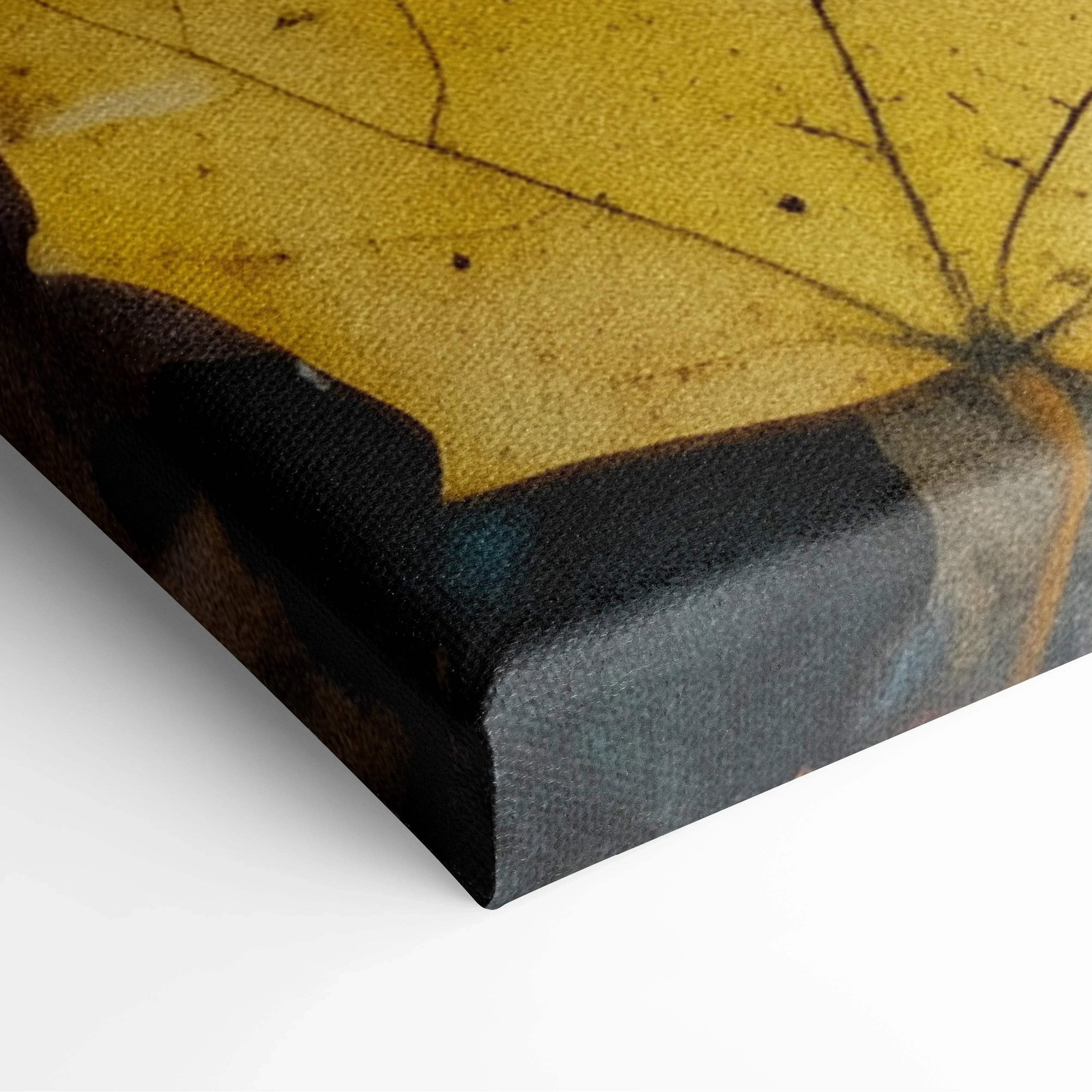 Close-up of vibrant autumn leaf on textured canvas wall art corner showing detailed print and wrapped edges.
