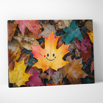 Autumn leaf with a happy face among colorful fallen leaves on canvas wall art.
