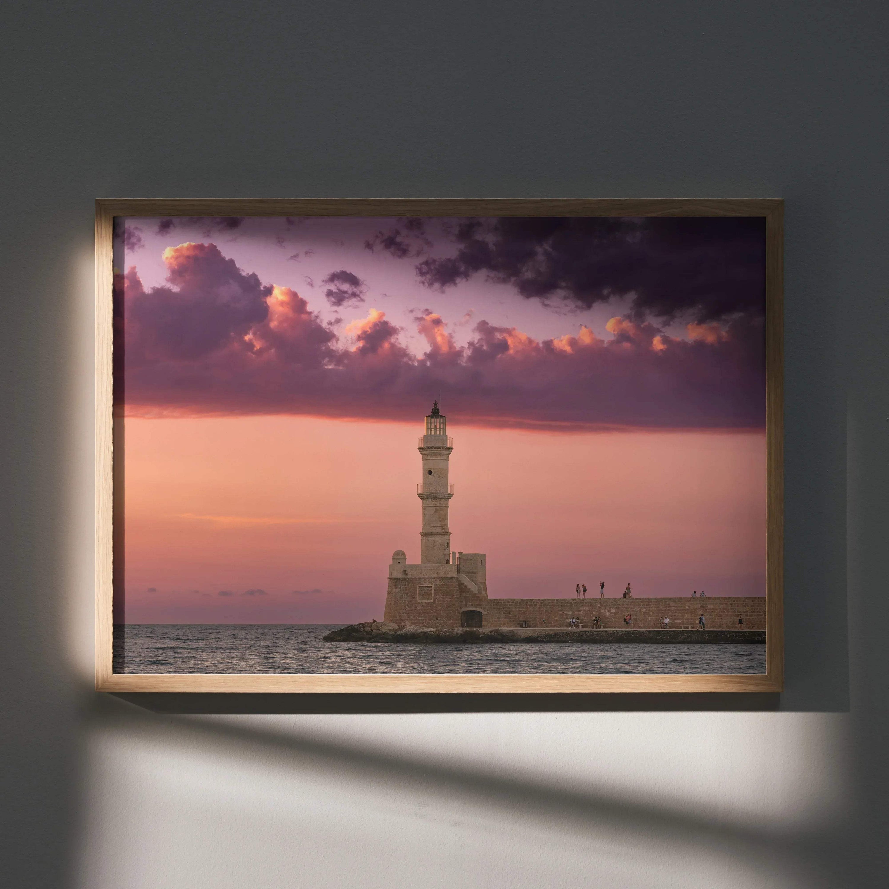Sunset wall art poster featuring a lighthouse and dramatic purple clouds over calm sea.
