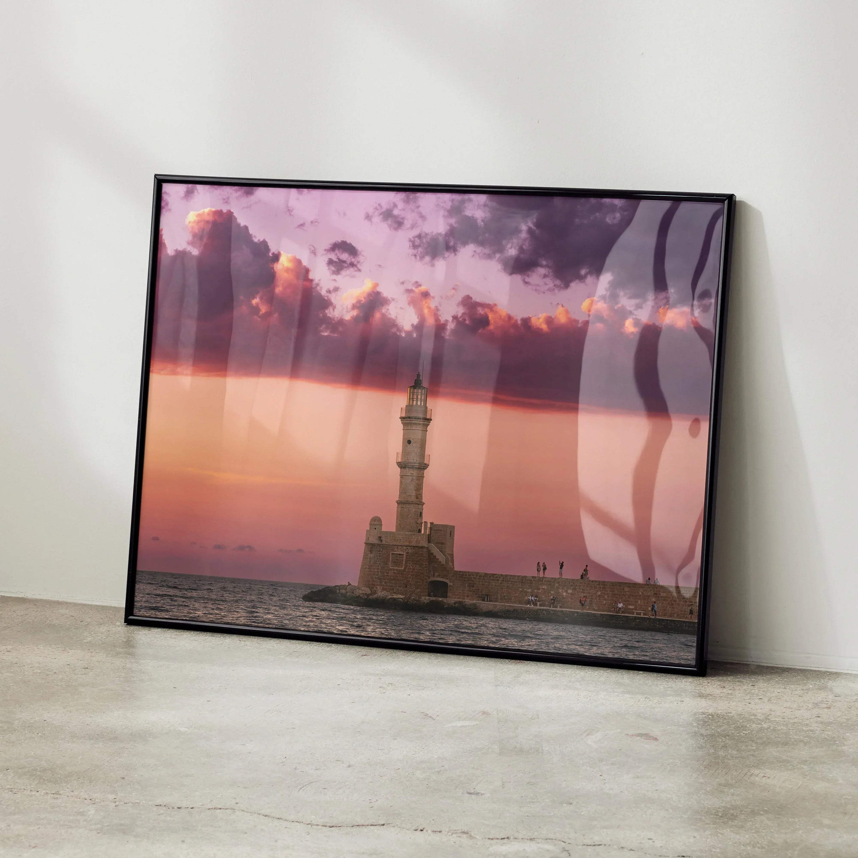 Sunset poster wall art featuring lighthouse and pink purple sky over calm sea.