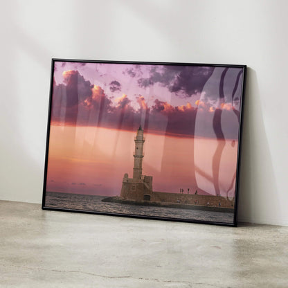 Sunset poster wall art featuring lighthouse and pink purple sky over calm sea.