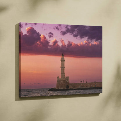 Canvas wall art featuring a lighthouse at sunset with purple and pink sky over ocean.