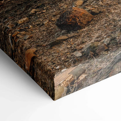 Close-up of textured desert mountain landscape on canvas wall art with rich earth tones.