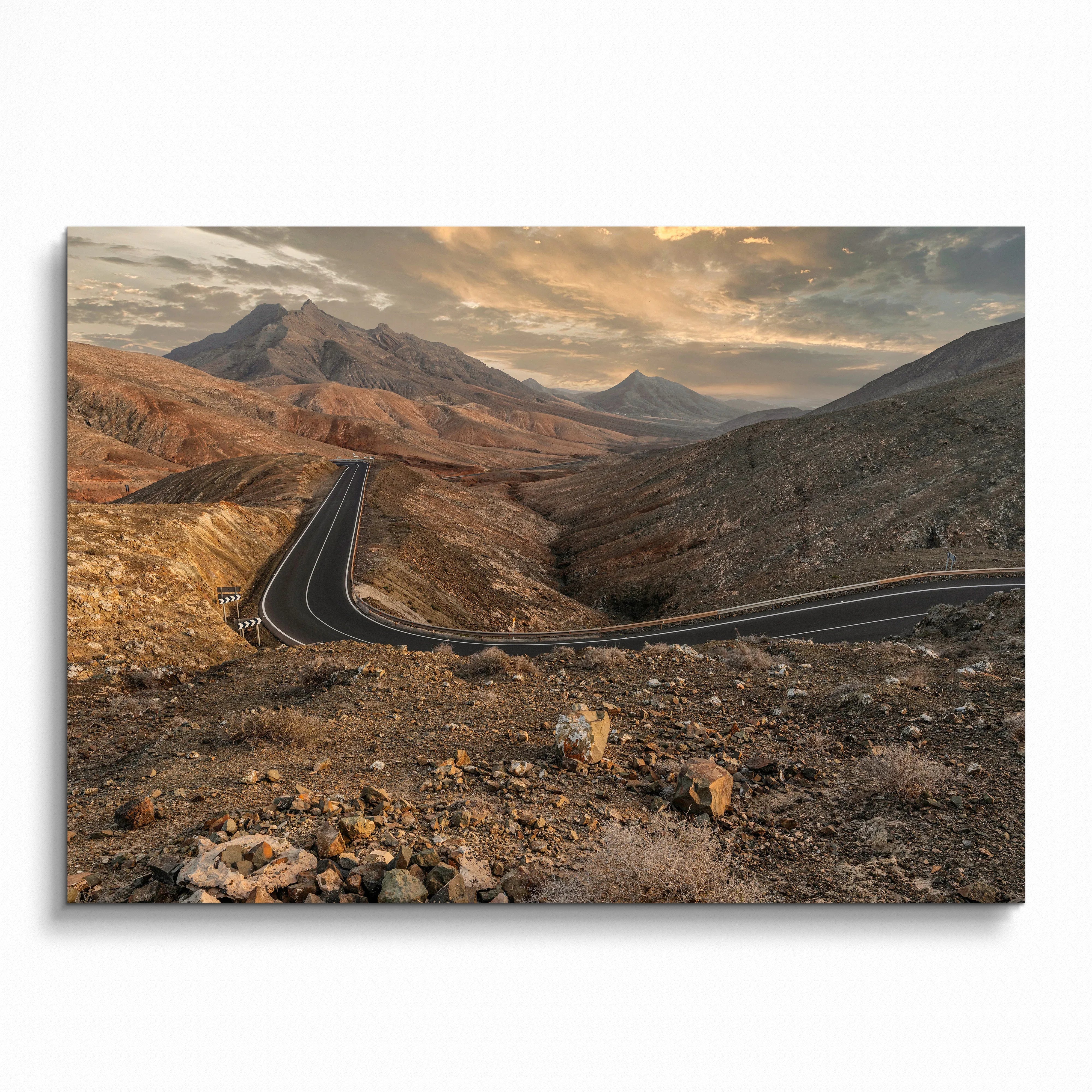 Mountain road winding through rocky terrain at sunset poster wall art print.