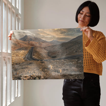 Stunning mountains sunset poster with winding road and warm golden light wall art.