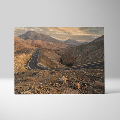 Desert mountains landscape with winding road canvas wall art in warm earthy tones.