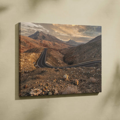 Desert mountains landscape printed on canvas wall art with winding road and warm earthy tones.