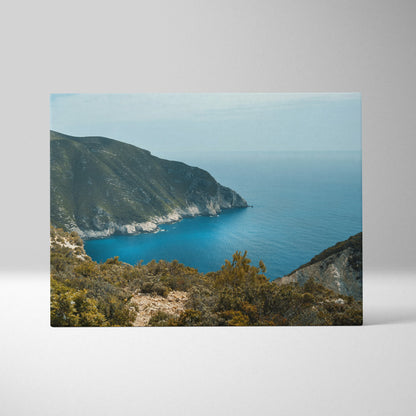 Mountain and ocean landscape canvas wall art with vibrant blue sea and rugged cliffs.