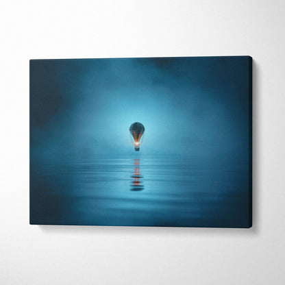 Blue glowing light bulb floating on teal water mist canvas wall art