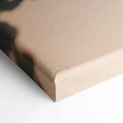 Close-up of beige textured canvas corner with stretched edge for wall art display.