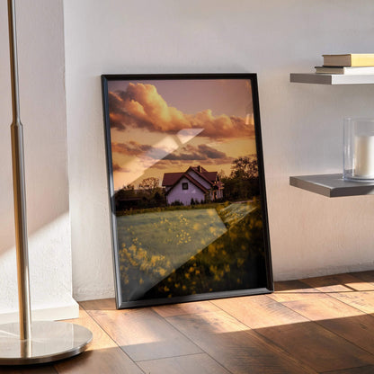 Vertical wall art poster featuring a sunset sky over a floral field and building in warm tones.