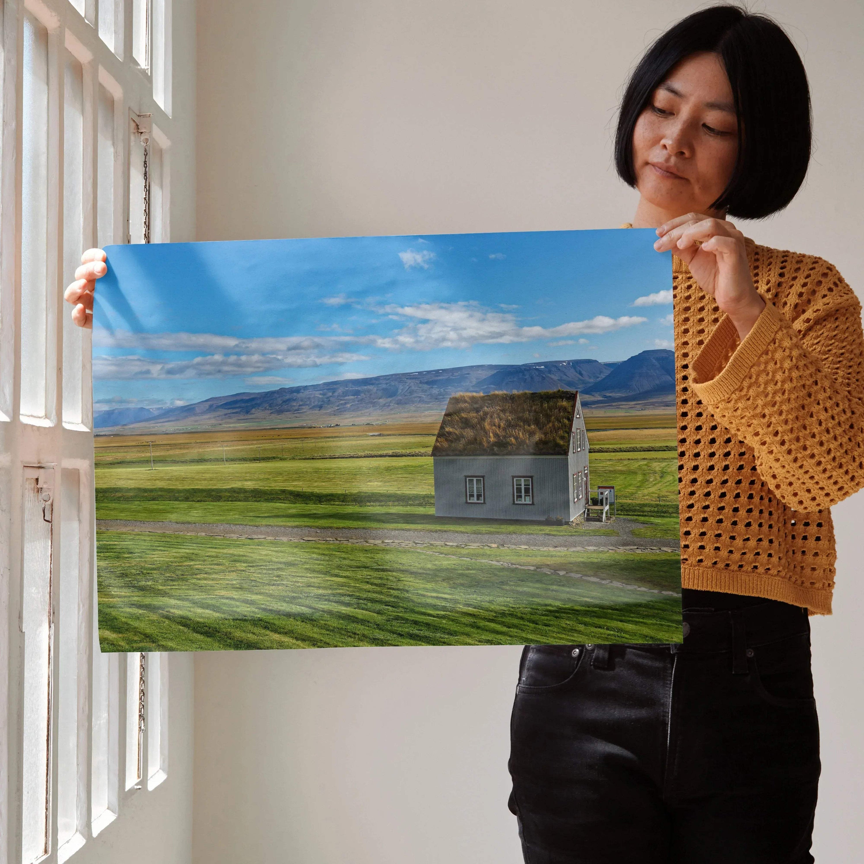 Modern architectural building wall art poster with solitary house on green field under blue sky.