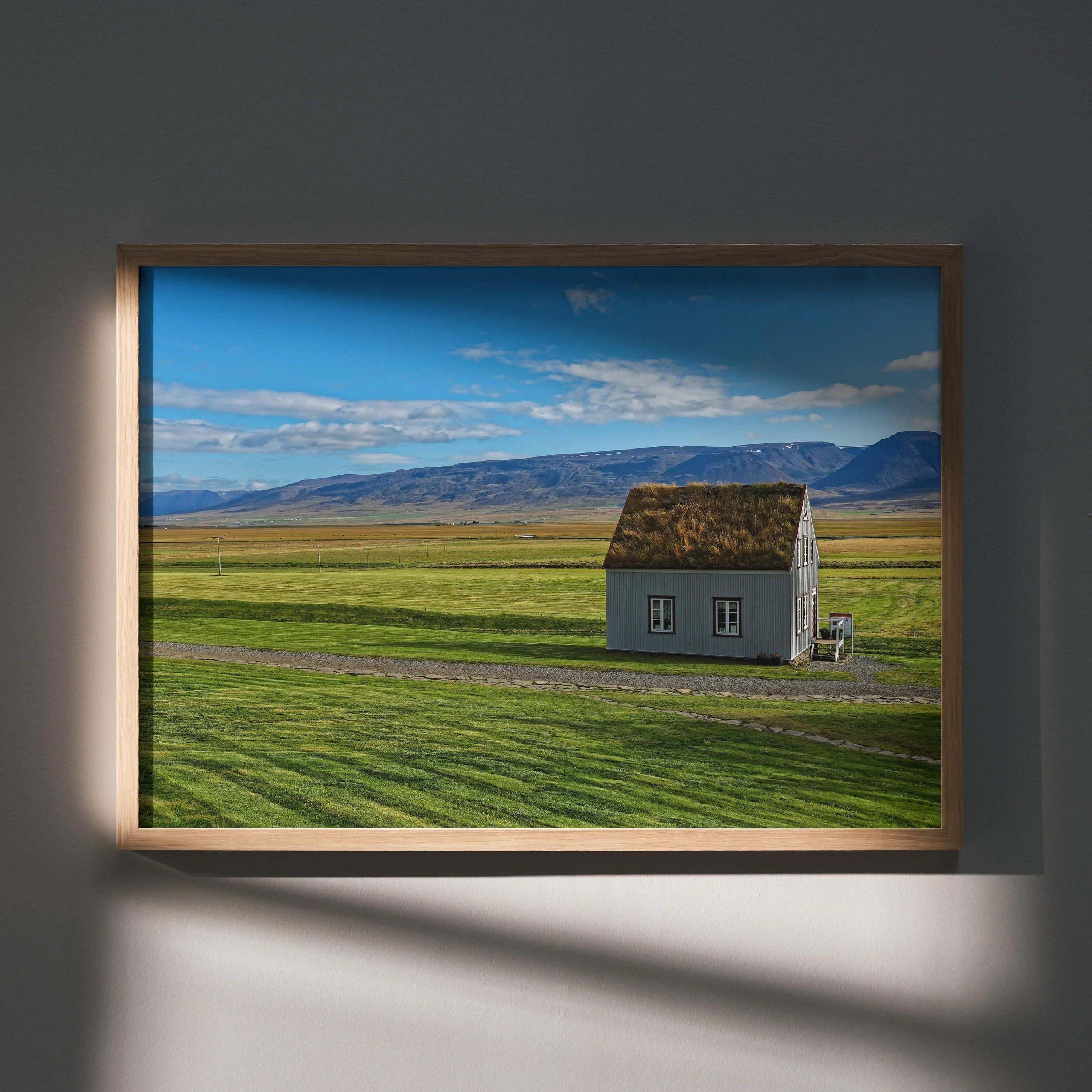 Modern architectural building poster featuring solitary house on green field with blue sky wall art.