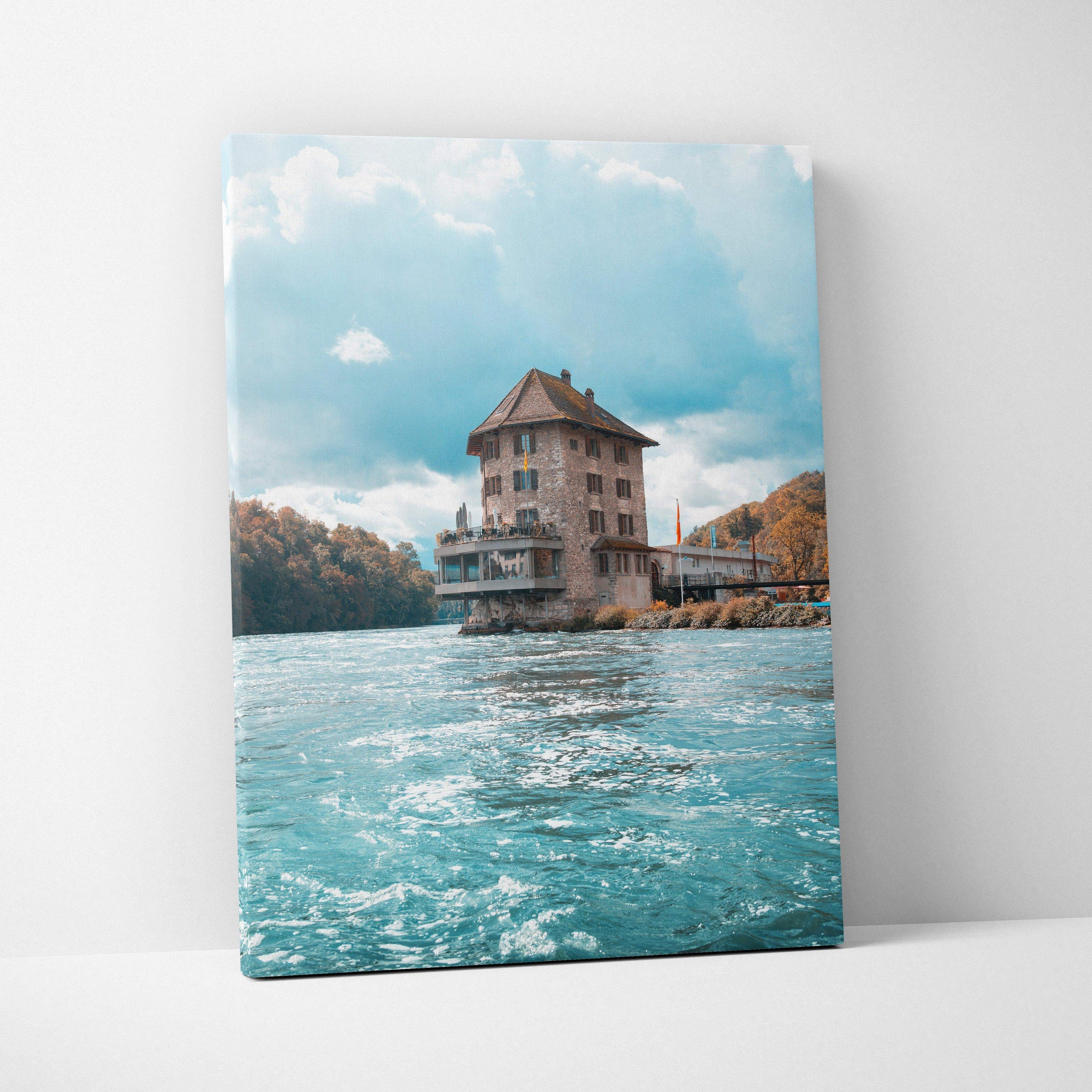 Canvas wall art featuring urban building over blue water under bright sky with clouds.