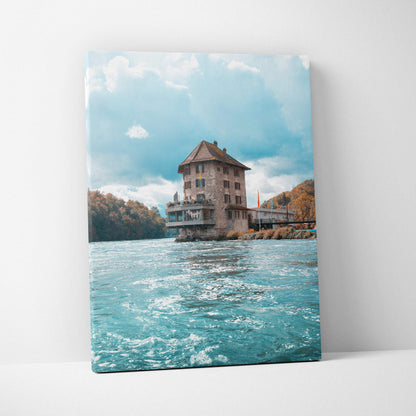 Canvas wall art featuring urban building over blue water under bright sky with clouds.