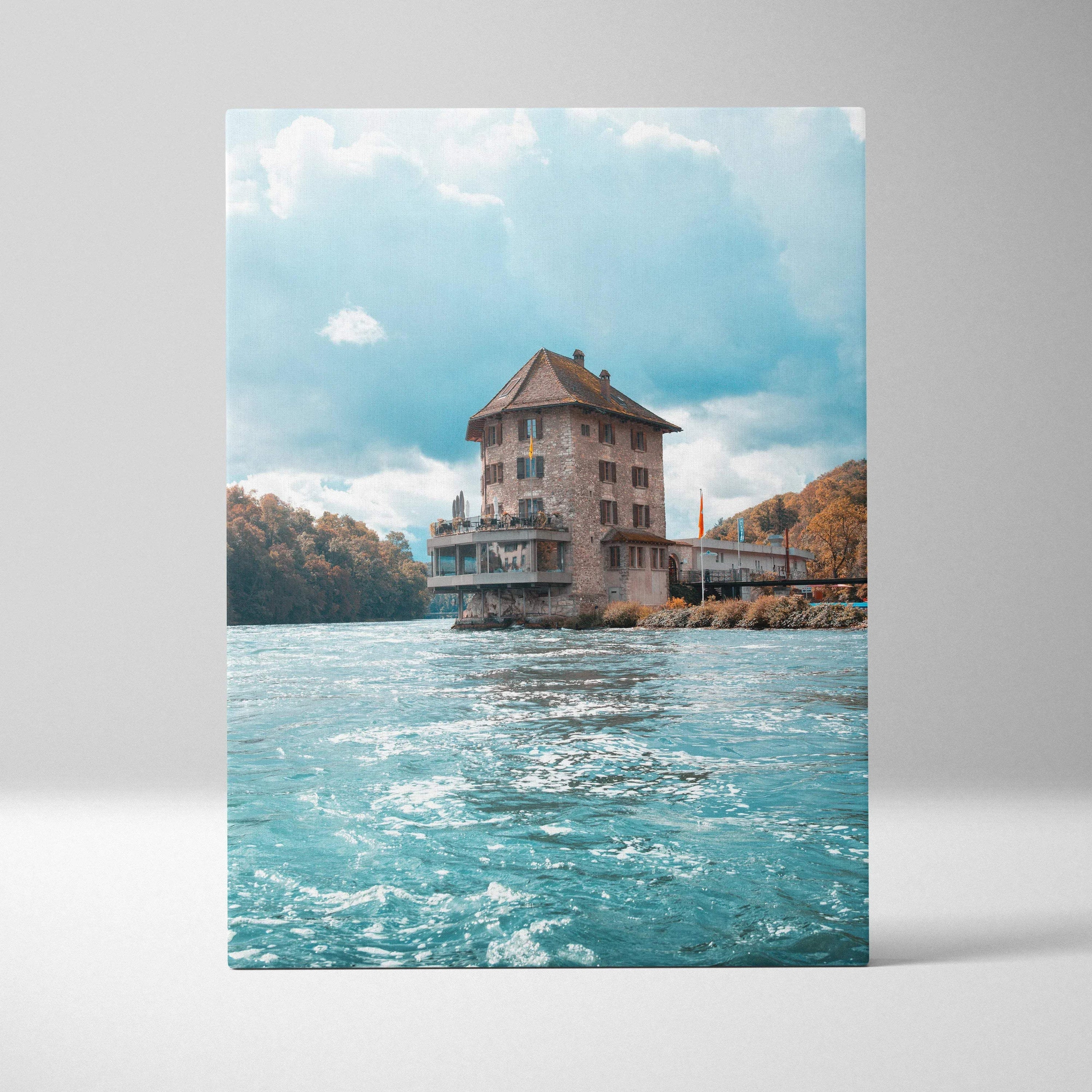 Canvas wall art featuring a tall historic building on water with a bright blue sky background.