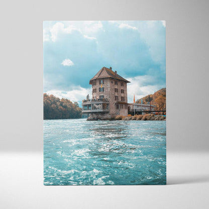 Canvas wall art featuring a tall historic building on water with a bright blue sky background.