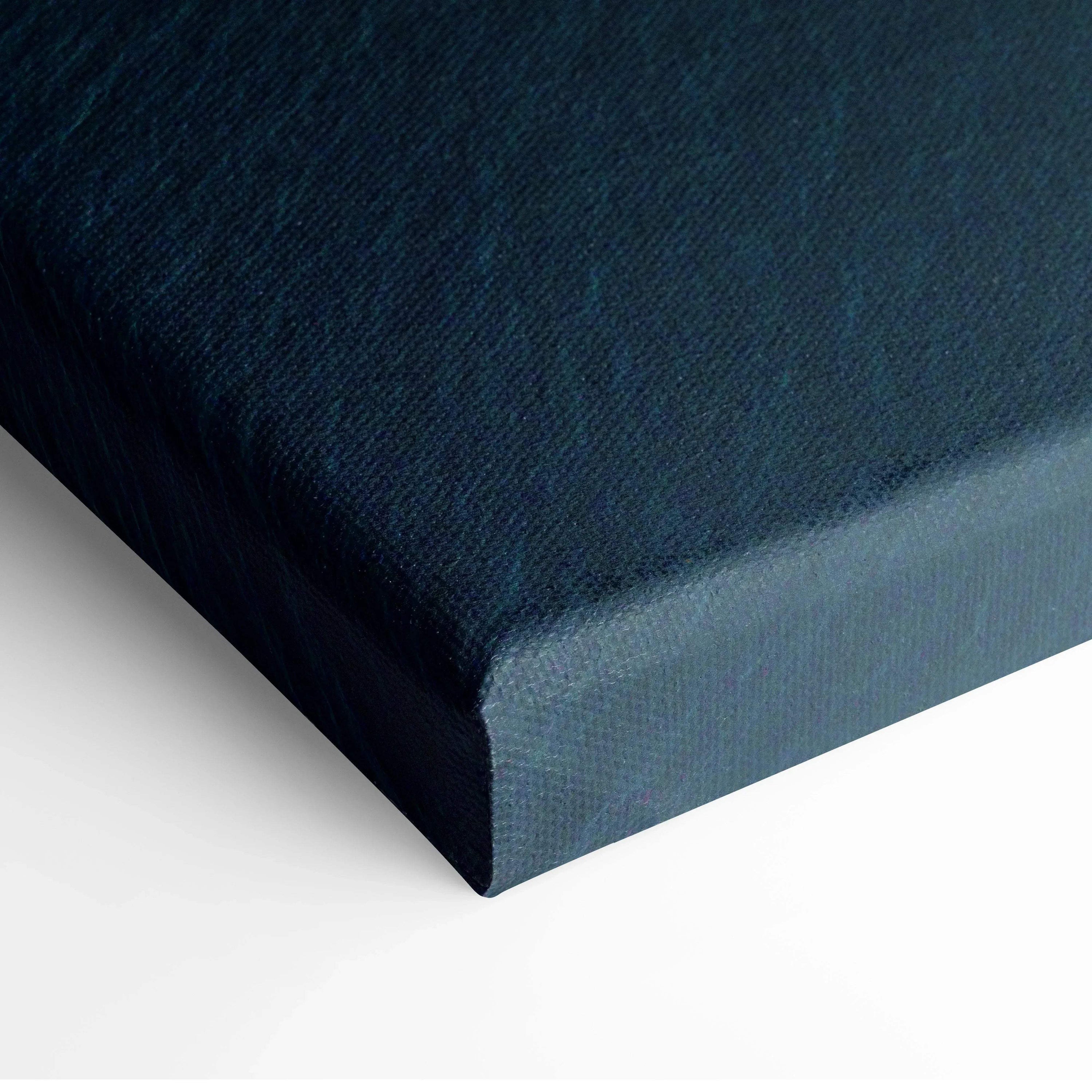 Close-up of dark blue canvas corner with textured fabric for wall art display.