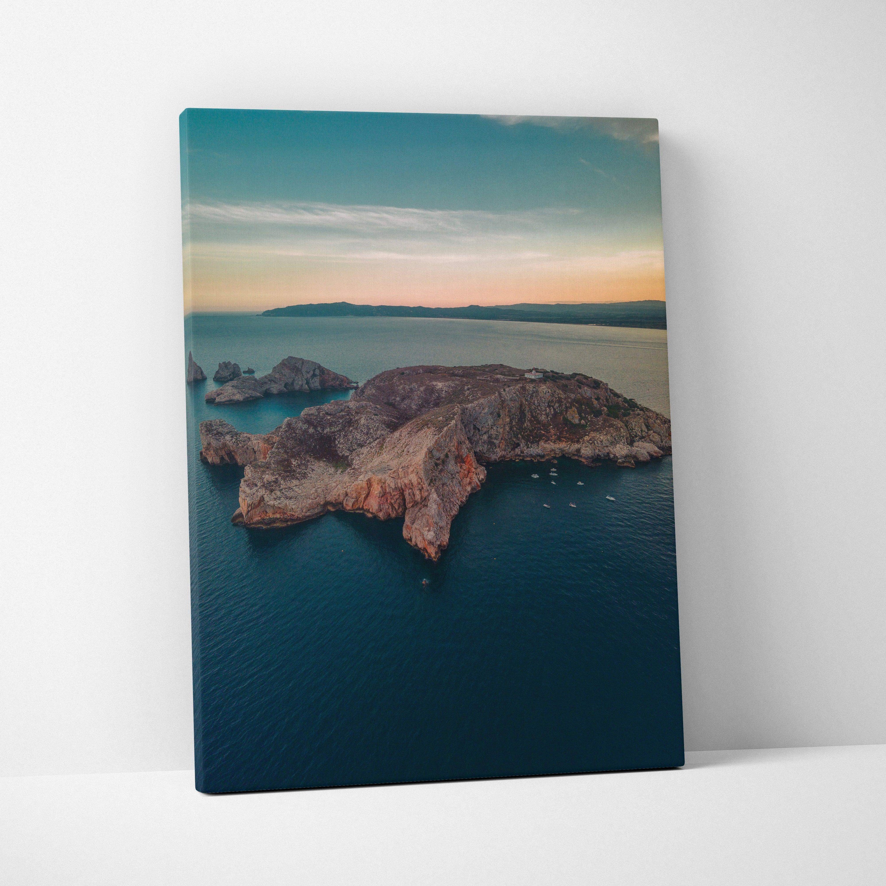 Vertical canvas wall art featuring tranquil mountain island and calm beach at sunset over ocean.