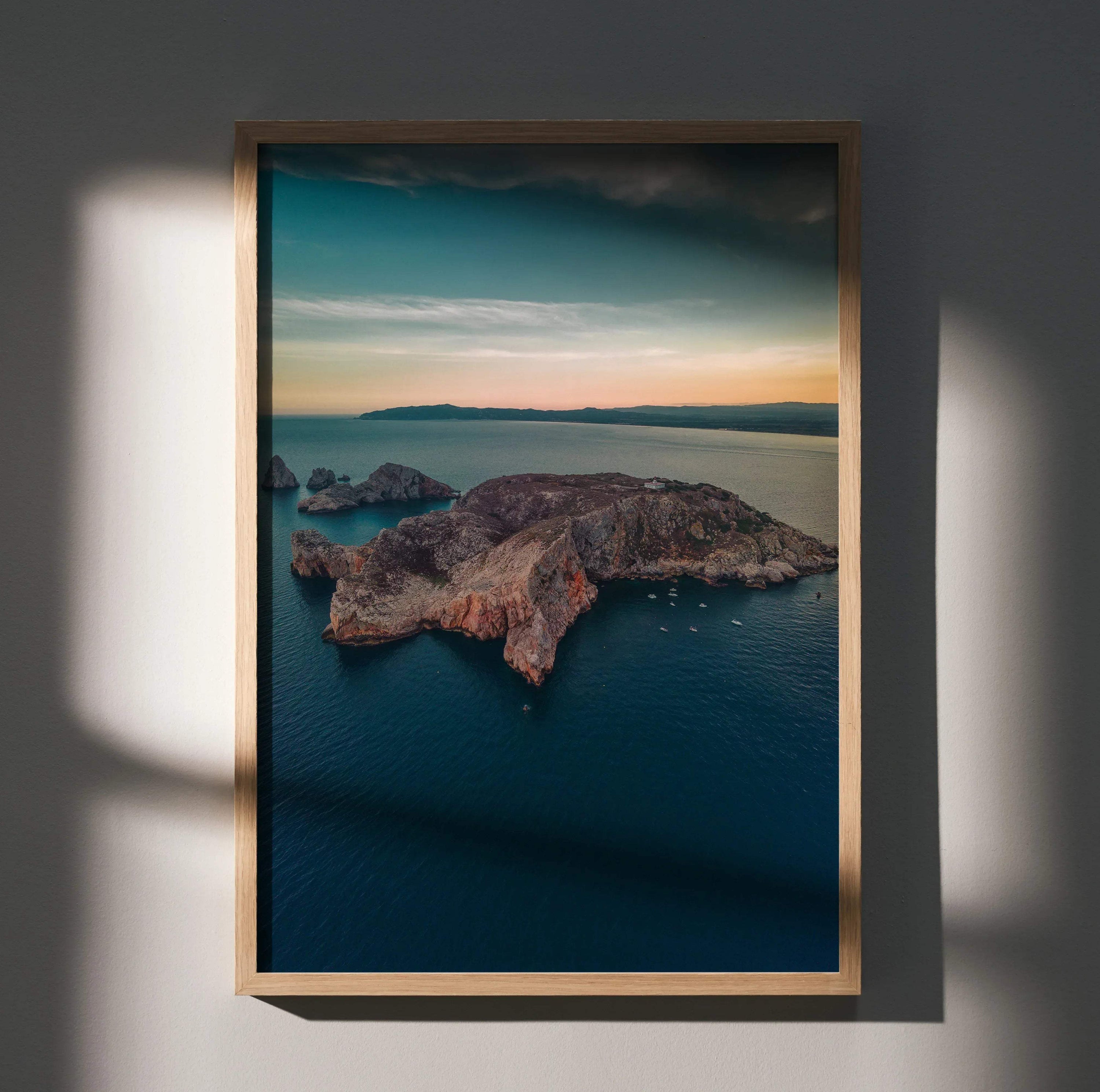 Vertical wall art poster featuring a rocky island with ocean and a colorful sunset sky.