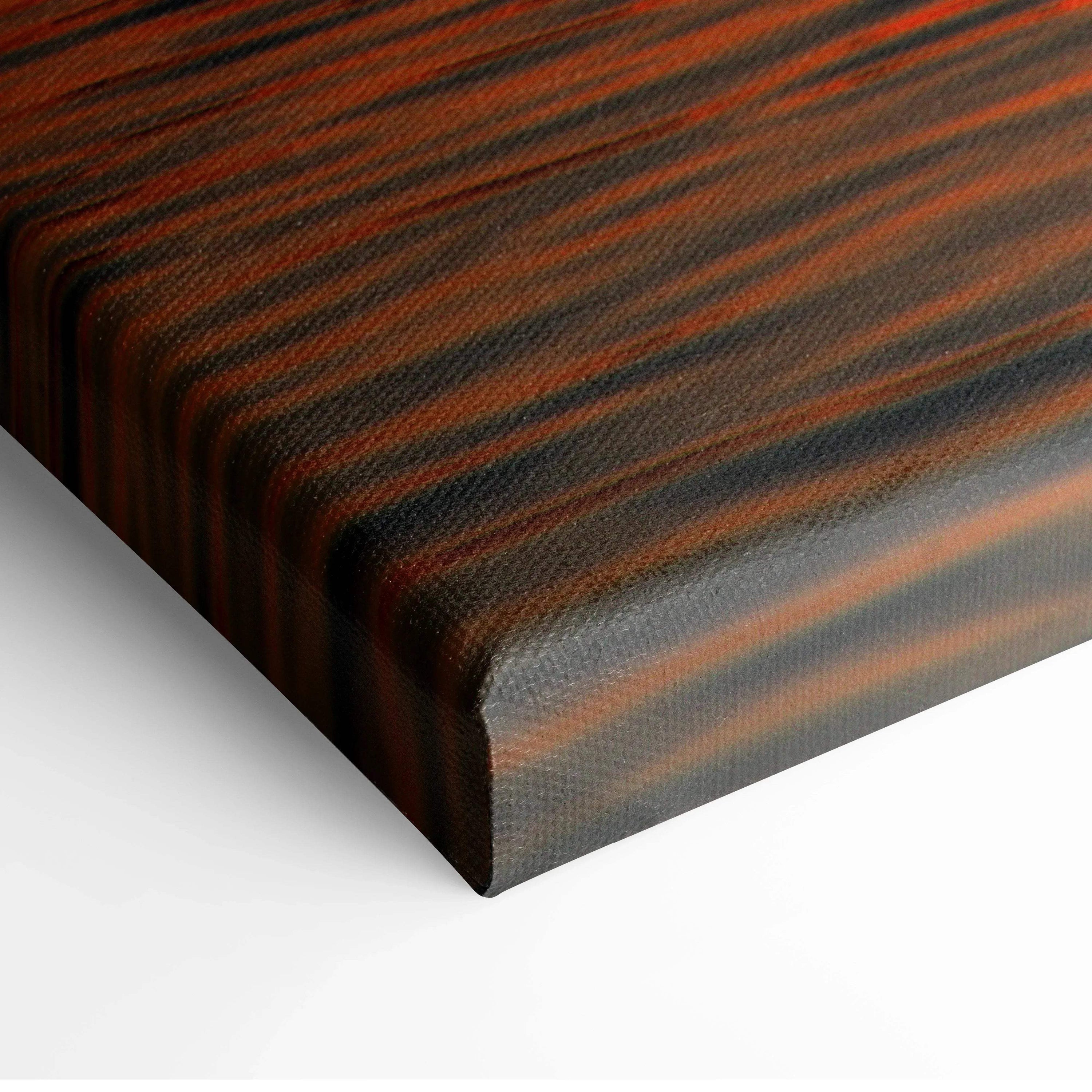 Close-up of vivid orange and black striped ocean sunset canvas wall art corner with textured surface.