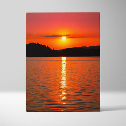 Vivid ocean sunset art canvas with vibrant orange sky and sun reflecting on calm water.