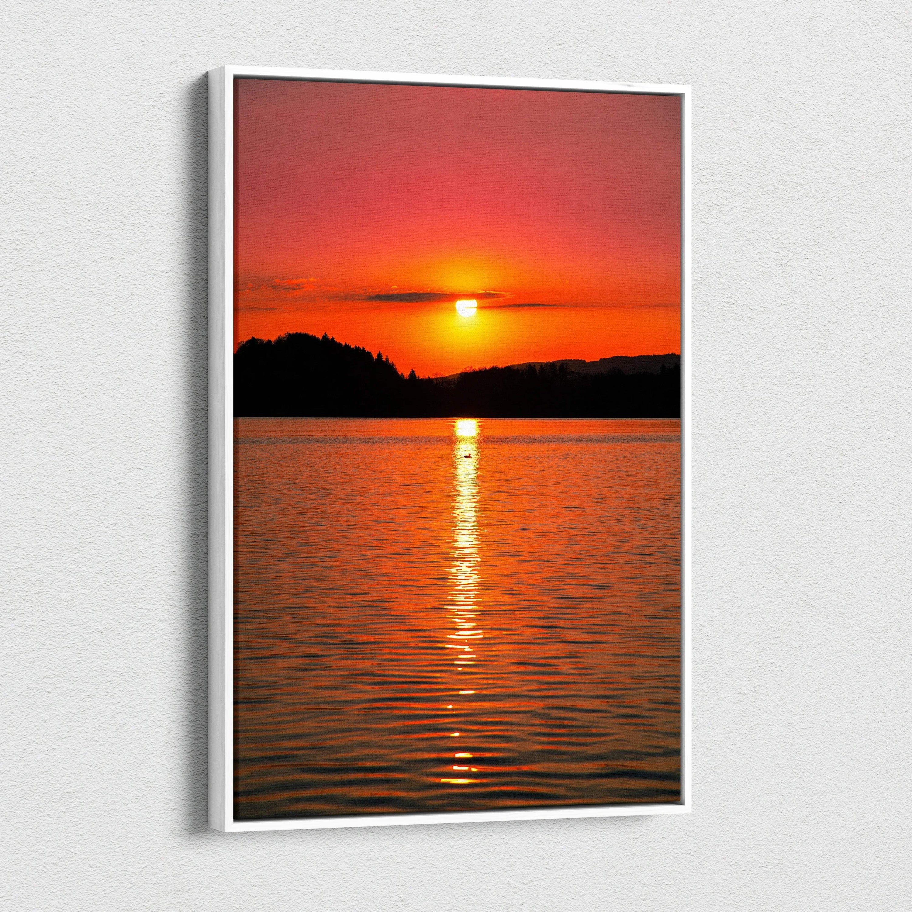 Vivid ocean sunset canvas wall art with glowing sun reflecting on calm water.