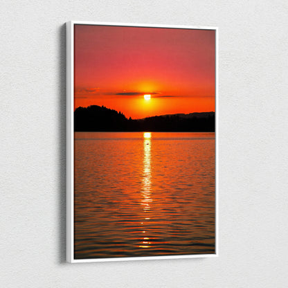 Vivid ocean sunset canvas wall art with glowing sun reflecting on calm water.