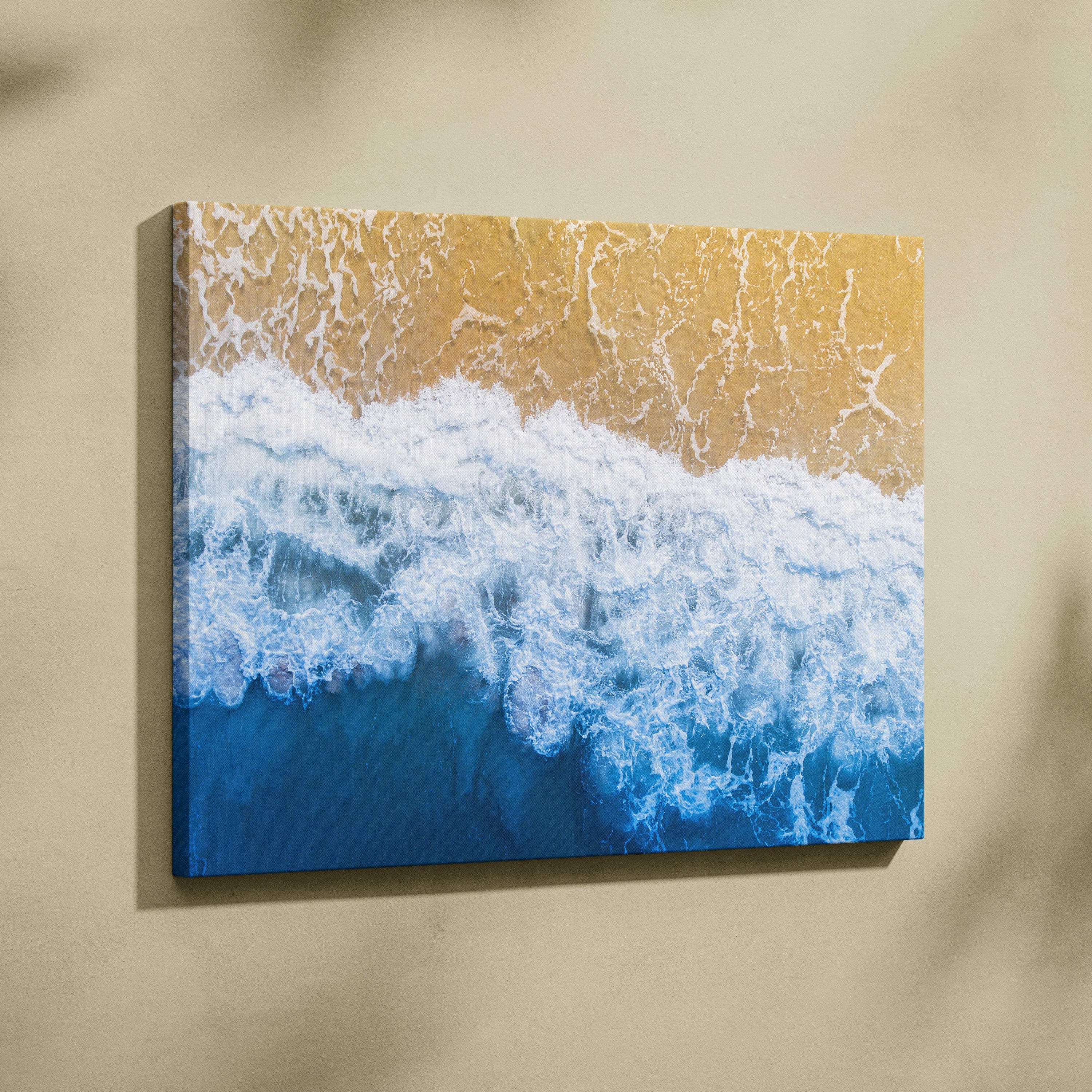 Rectangular canvas print of vibrant blue ocean waves crashing on golden sand for coastal living room decor
