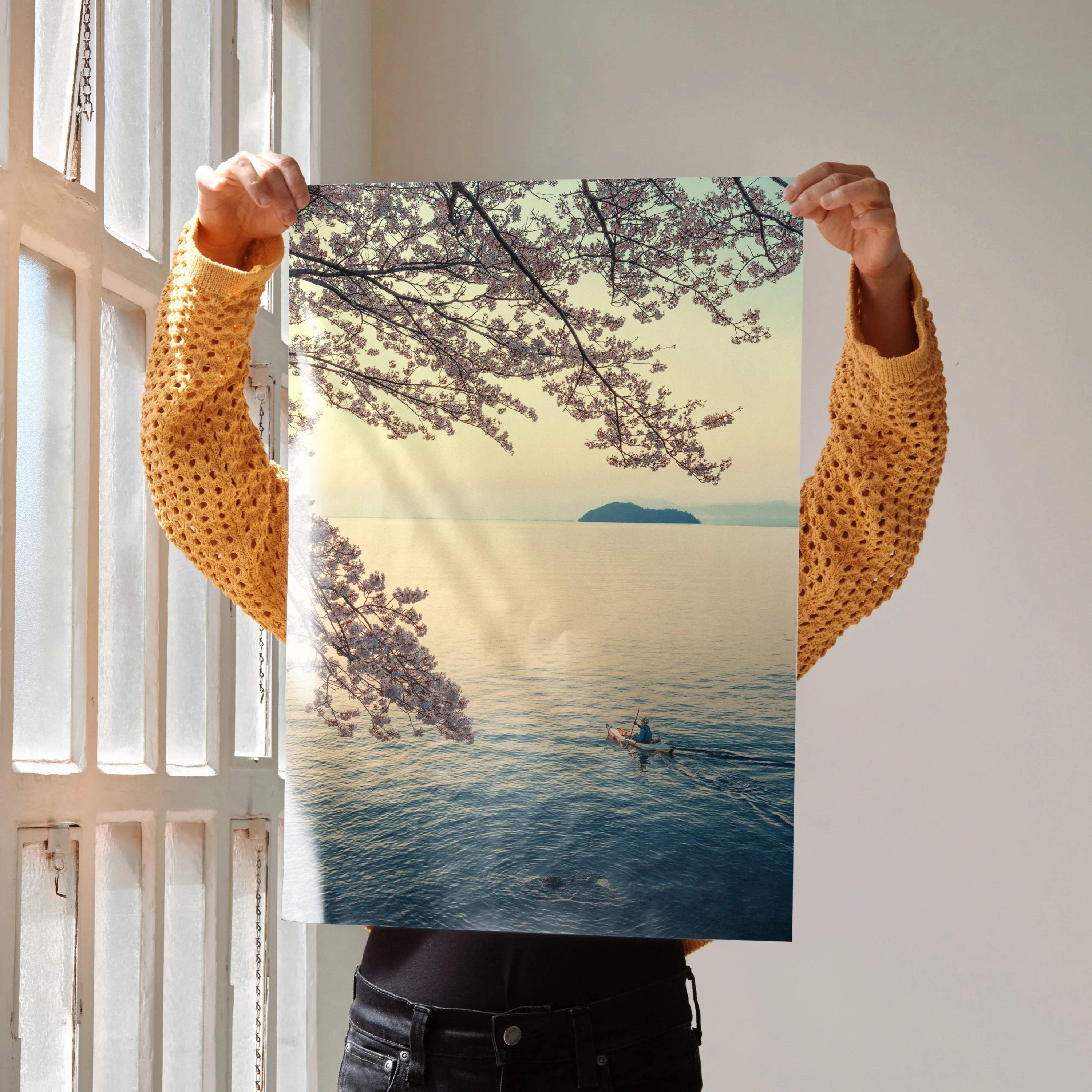 Serene ocean and cherry blossom poster with soft pastel colors and tranquil boat scene wall art.