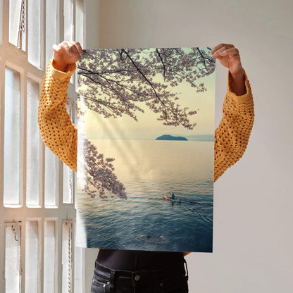 Serene ocean and cherry blossom poster with soft pastel colors and tranquil boat scene wall art.