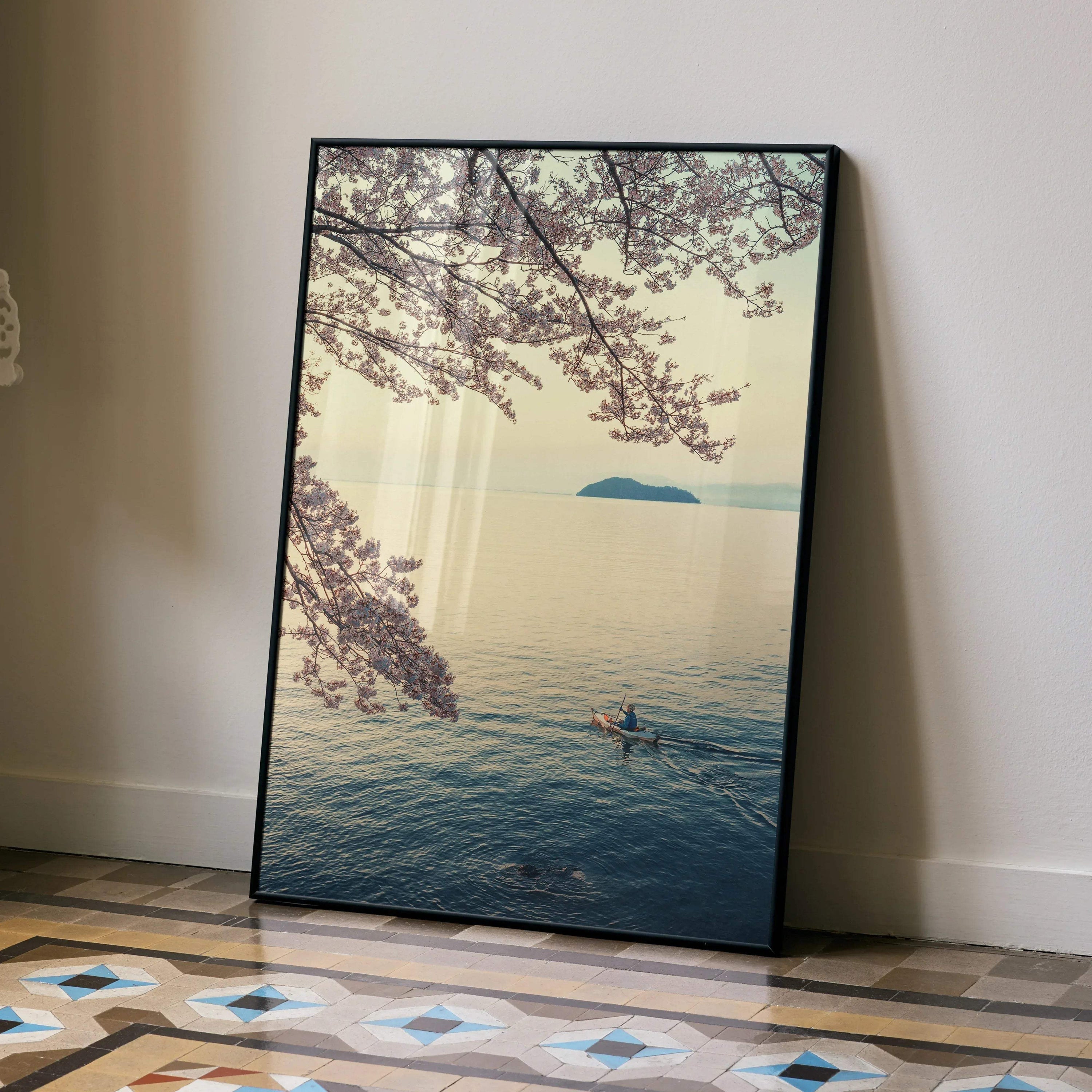 Serene ocean view with cherry blossom branches framed in black poster wall art.