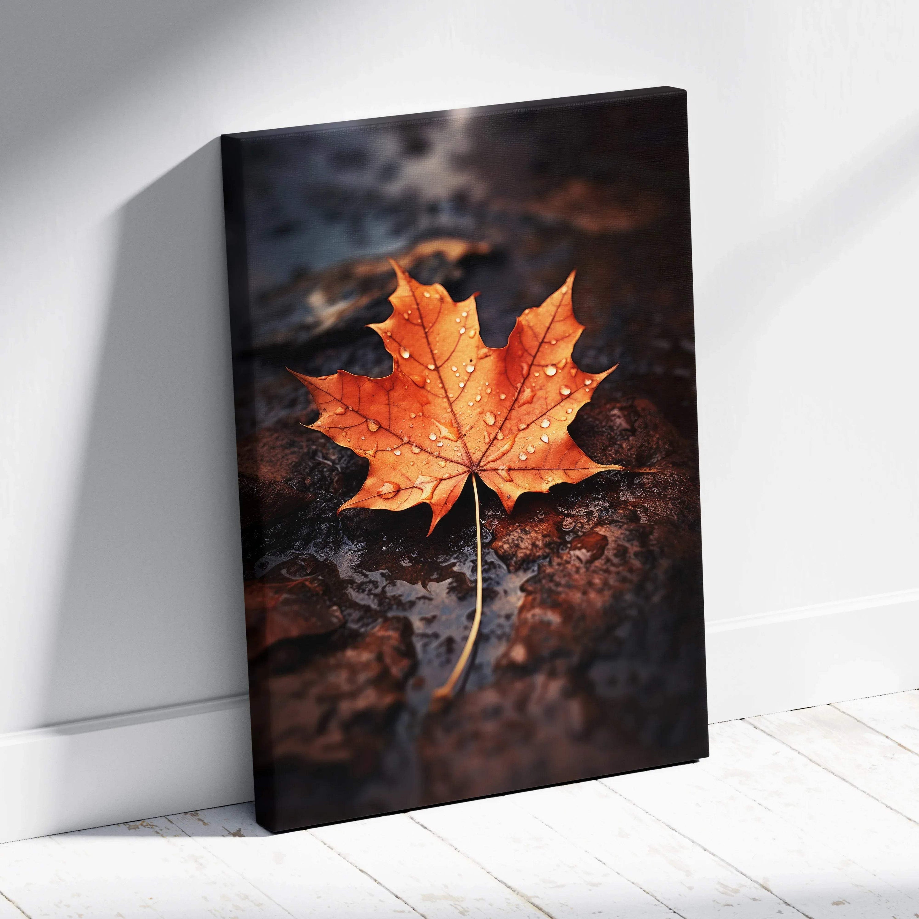 Canvas wall art featuring a vibrant orange autumn maple leaf with water droplets on a dark textured background.