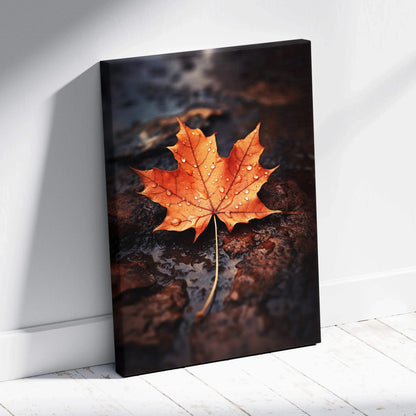 Canvas wall art featuring a vibrant orange autumn maple leaf with water droplets on a dark textured background.