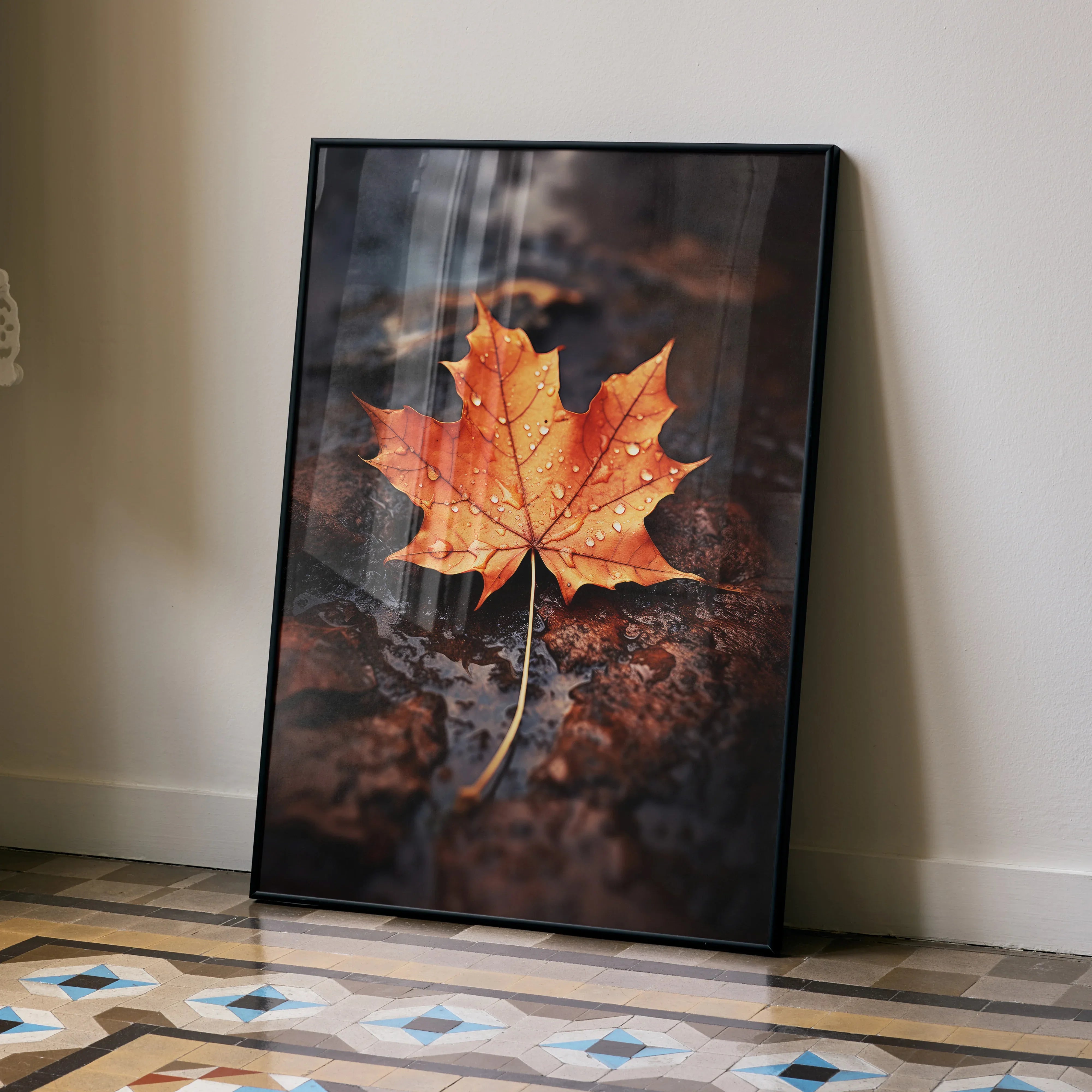 Vertical poster wall art featuring a close-up of a vibrant orange autumn leaf on forest floor background.