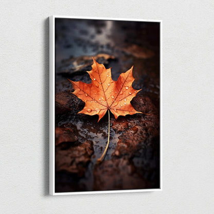 Canvas wall art featuring a vibrant orange autumn maple leaf on dark wet ground.