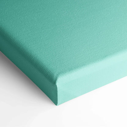 Close-up of teal blue canvas wall art with textured surface and wrapped edges.