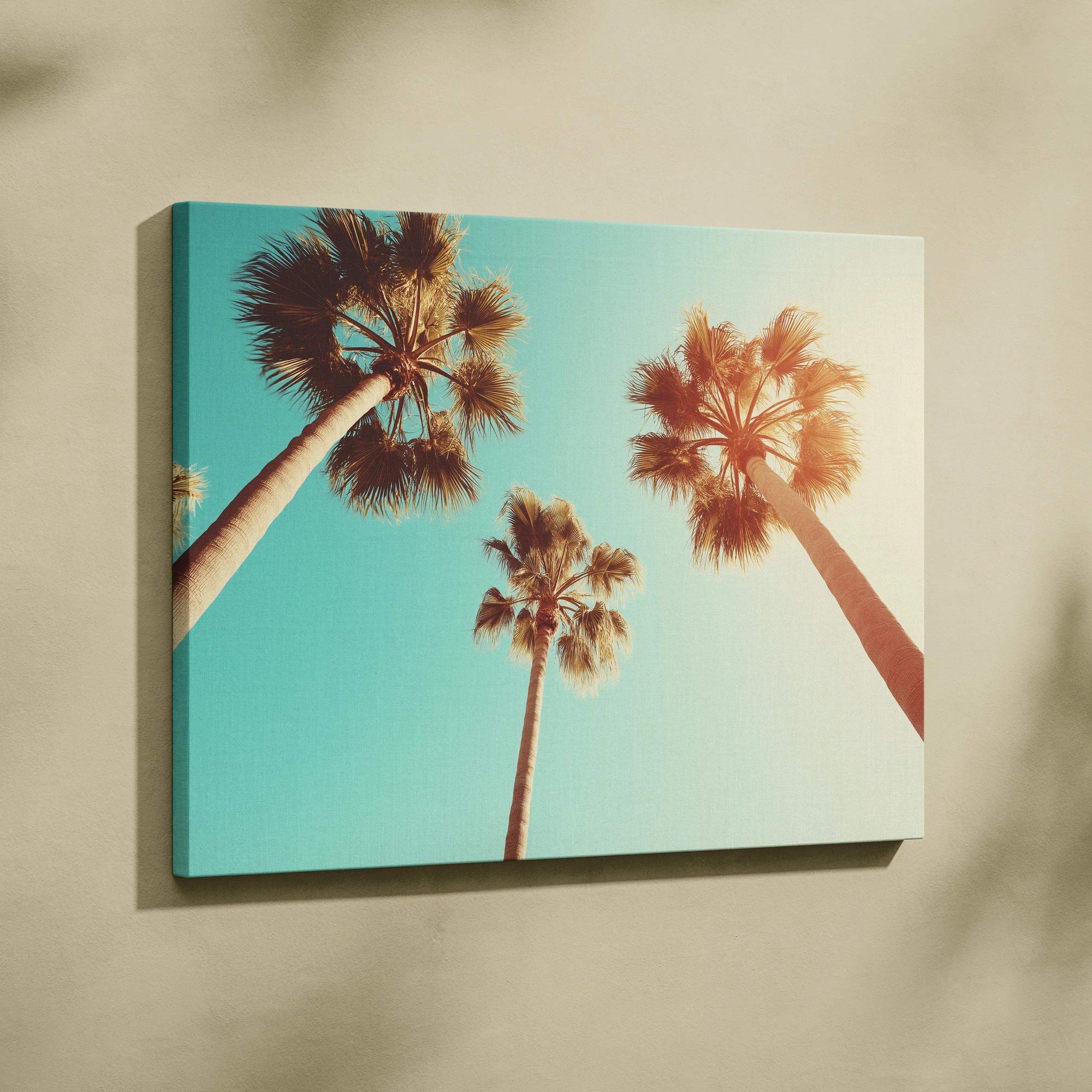 Canvas wall art featuring upward view of three palm trees with clear blue sky background.