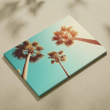 Canvas wall art featuring tall palm trees against a clear blue sky with a warm vintage tone.