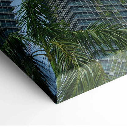 Urban architecture canvas wall art featuring palm leaves and modern buildings detail.
