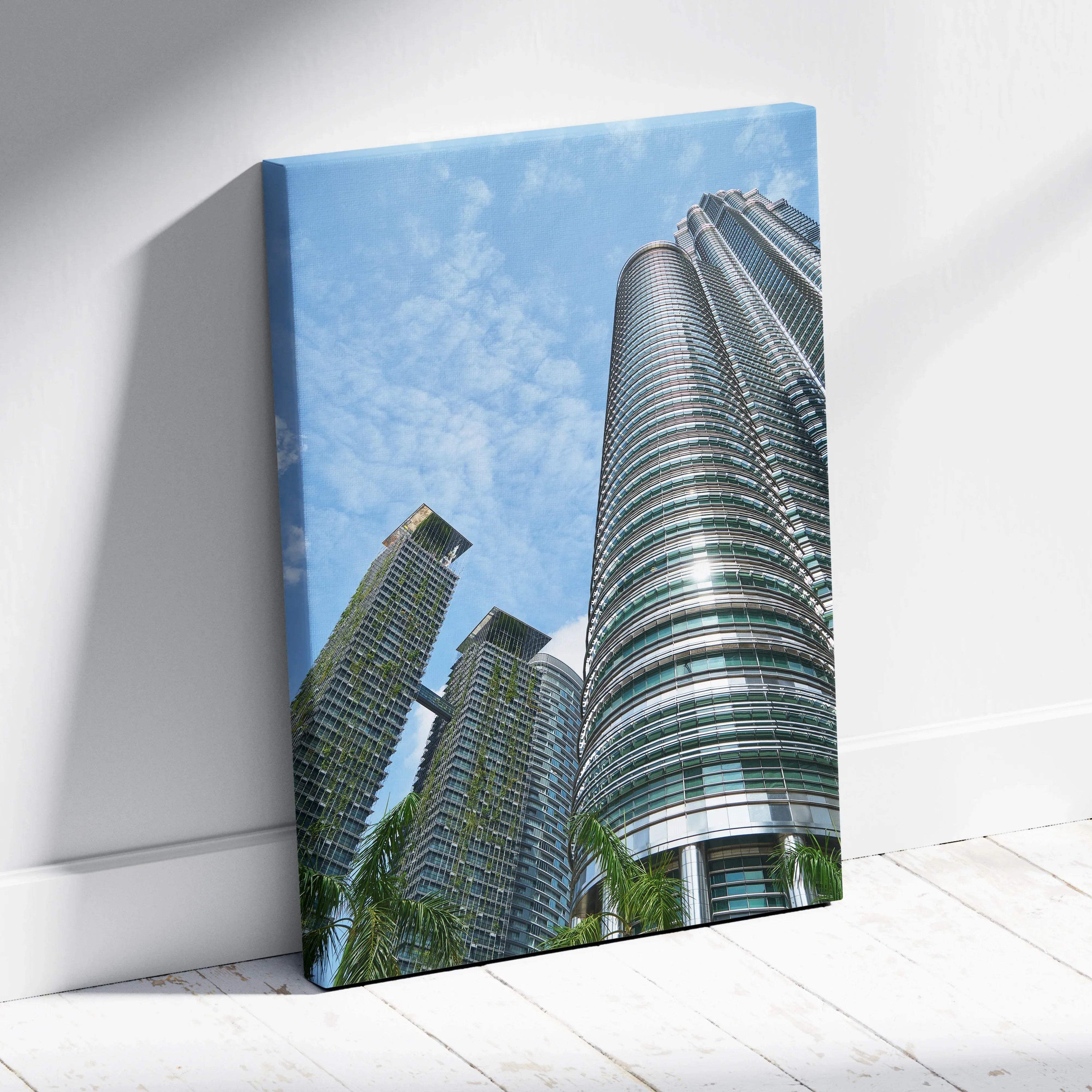 Vertical canvas wall art featuring modern urban skyscrapers under a blue sky.