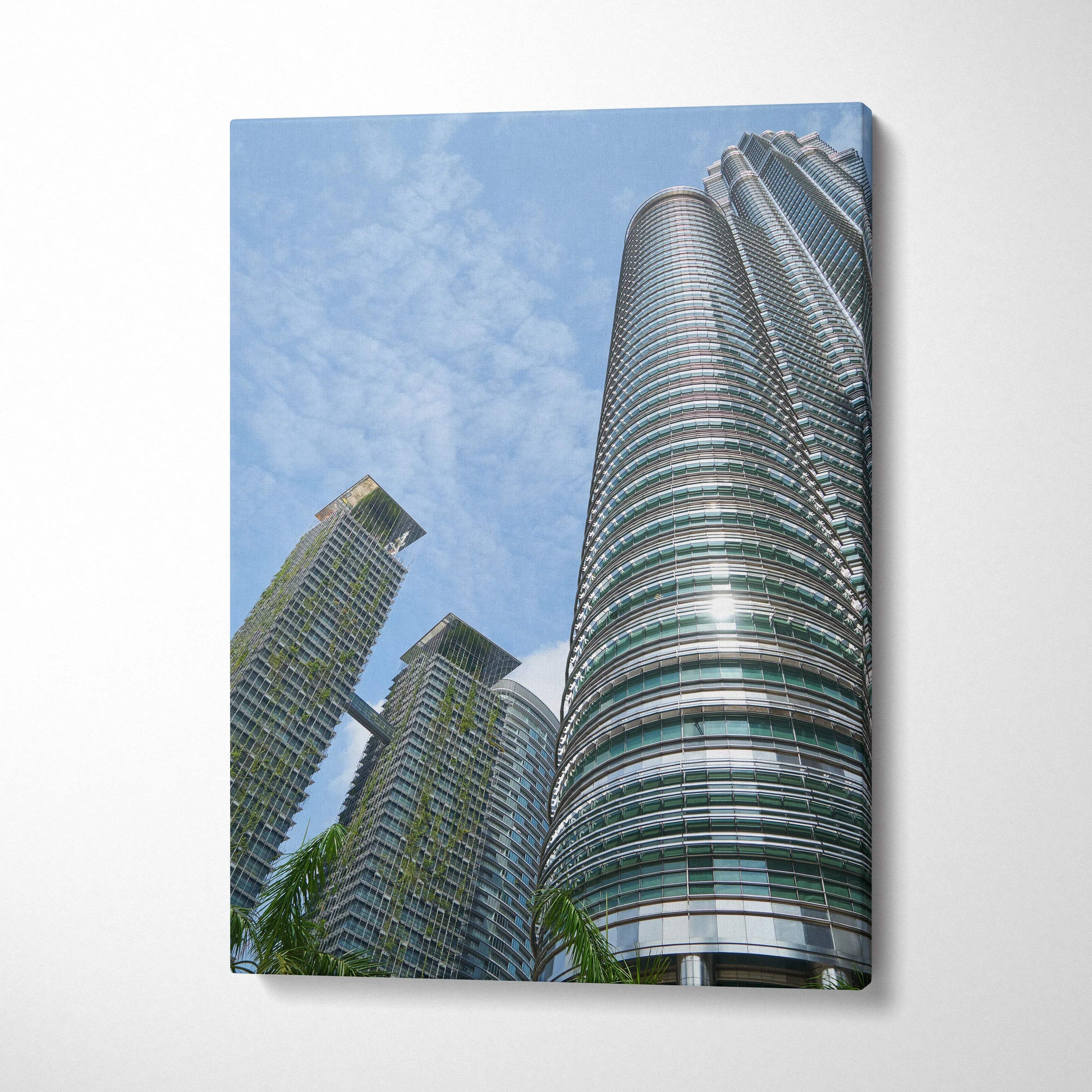 Vertical canvas wall art featuring modern urban skyscrapers against a clear blue sky.