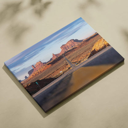 Desert landscape canvas wall art with red rock formations and blue sky in warm tones.