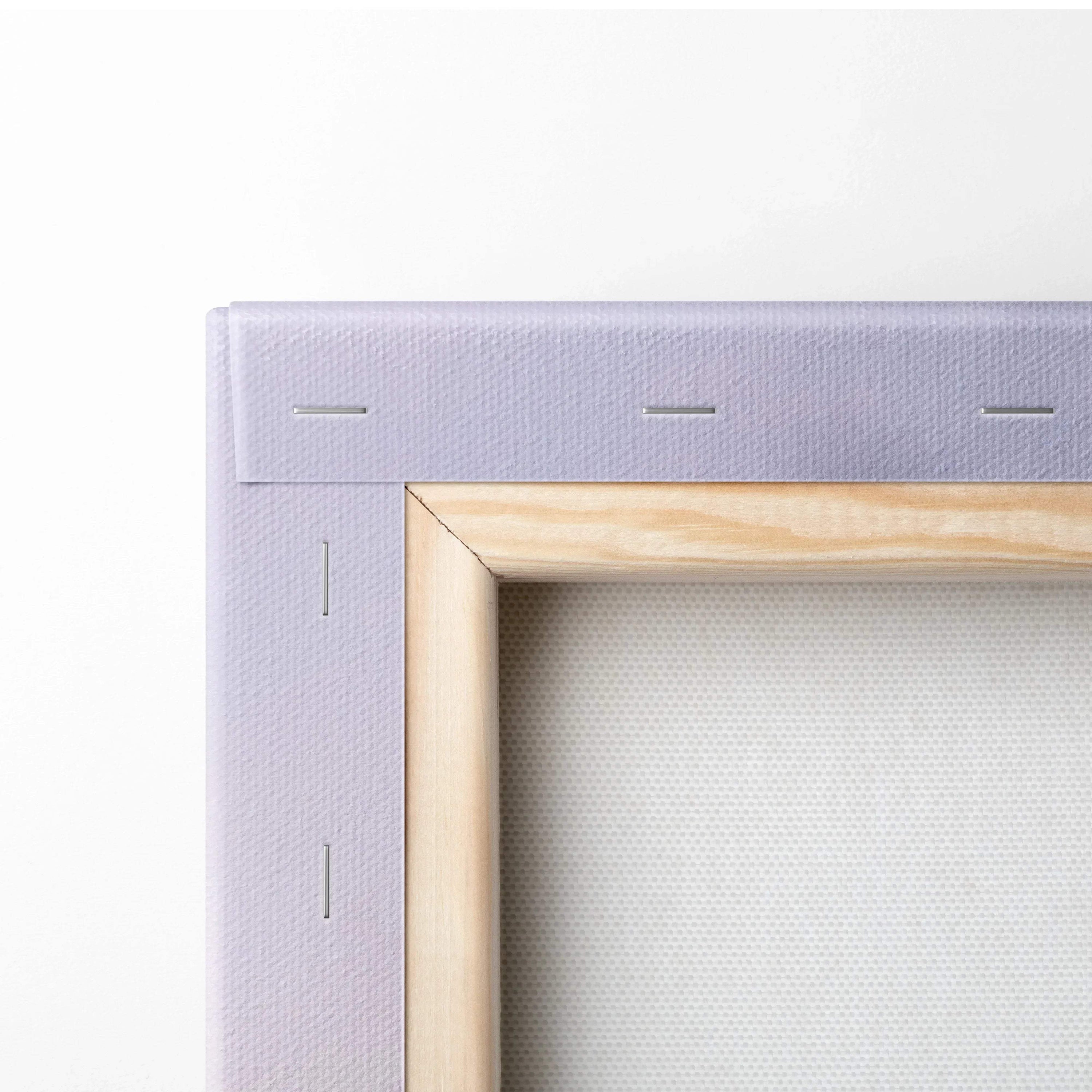 Close-up of wooden frame and stapled edge on modern urban skyline canvas wall art print.