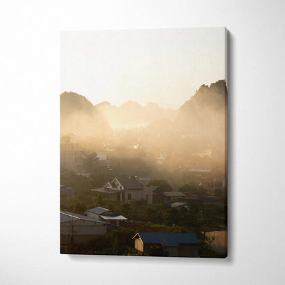Vertical canvas wall art featuring a misty mountain landscape at sunrise with soft golden light.
