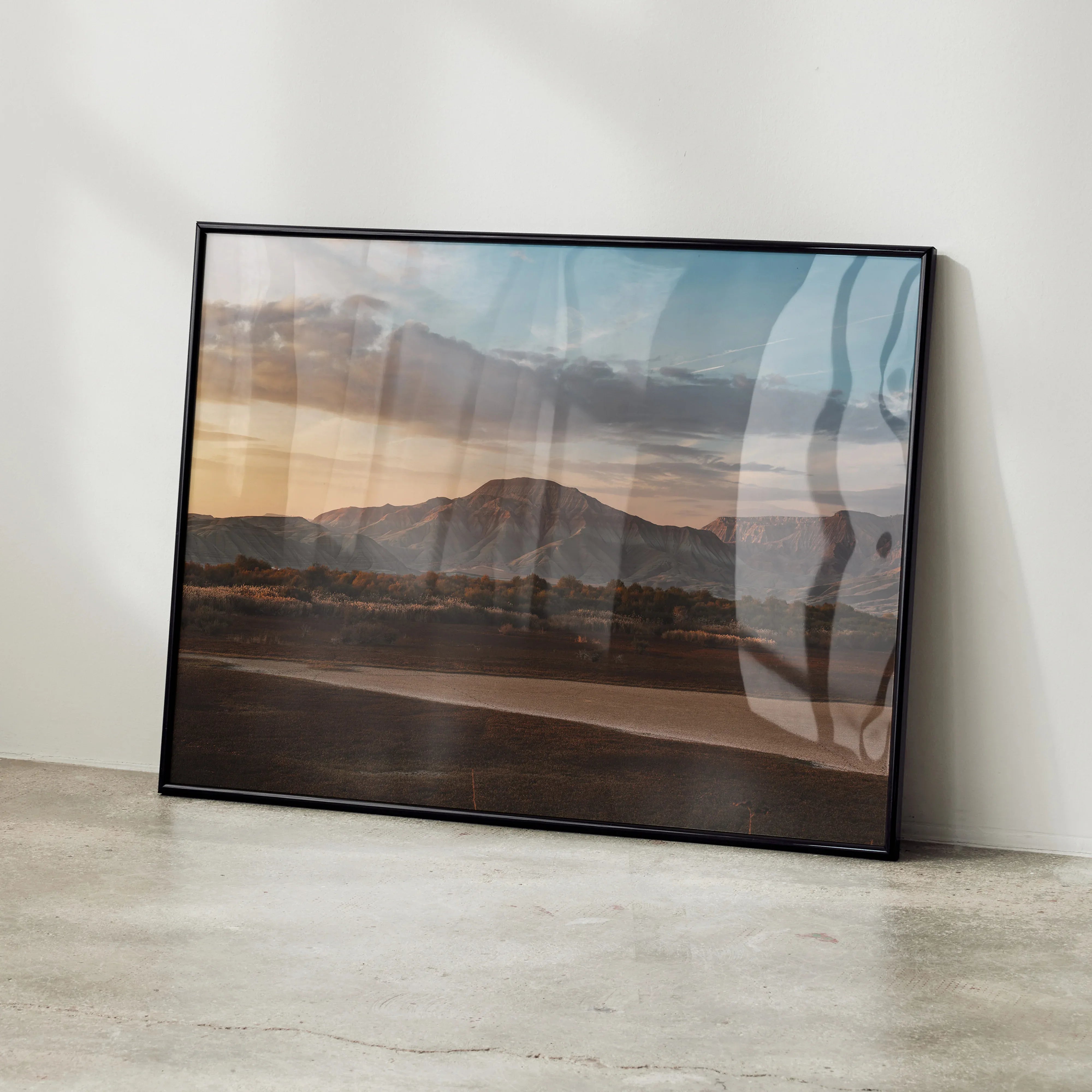 Majestic Mountain Wall Art poster with sunset sky and mountain silhouette in black frame.