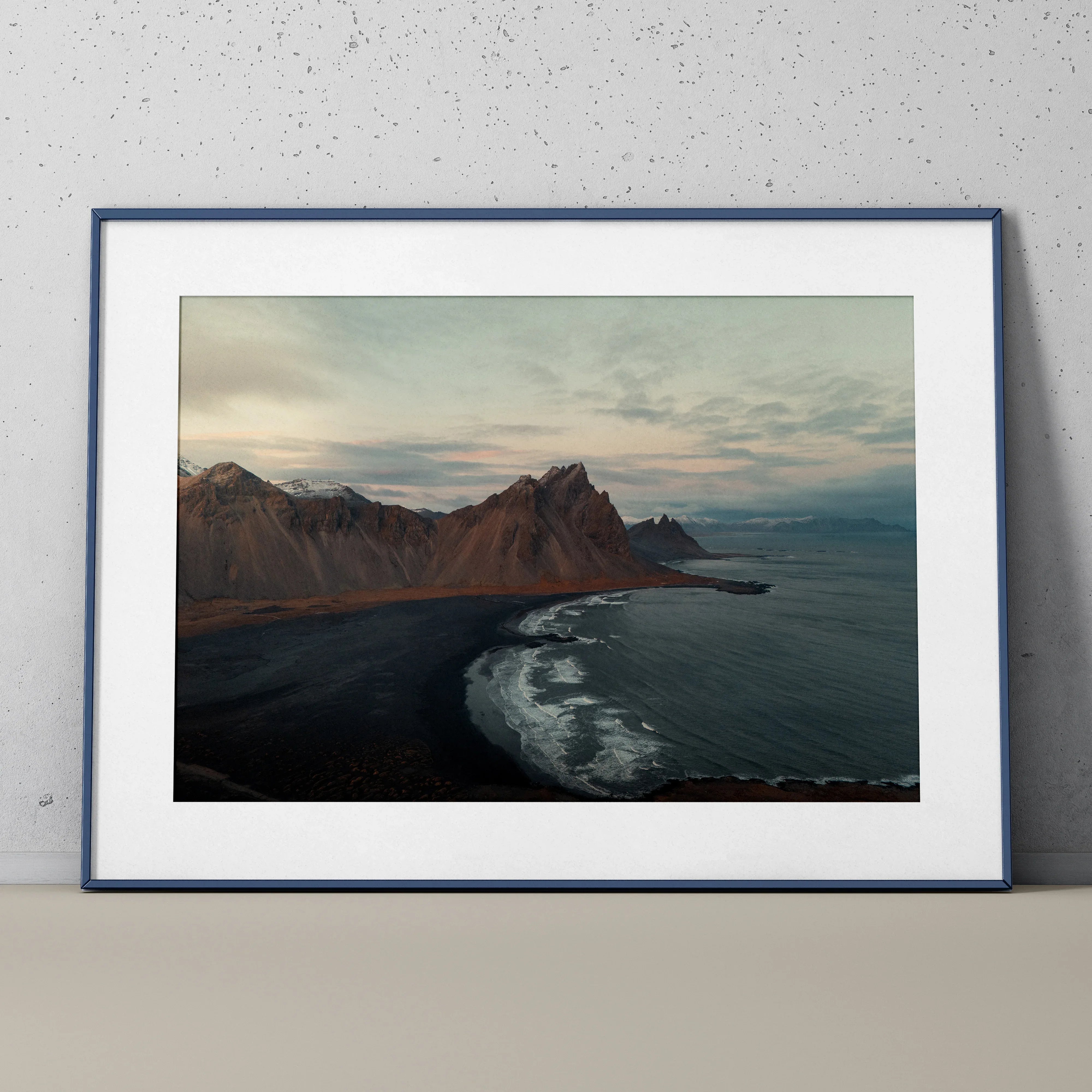 Majestic mountain landscape poster with dark shoreline and ocean waves, nature wall art print.