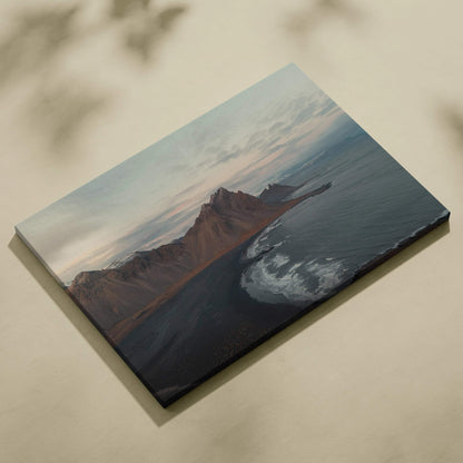 Canvas wall art featuring majestic mountains overlooking a serene beach at sunset with soft pastel skies.